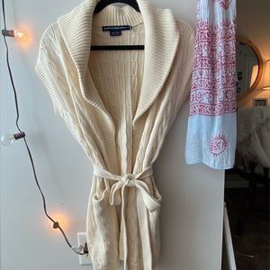 Cream sleeveless wrap sweater